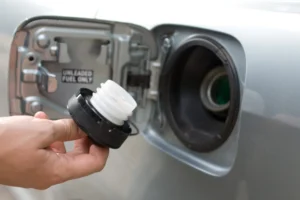 10 DIY CarHacks 08 gas cap in male hand scaled 1